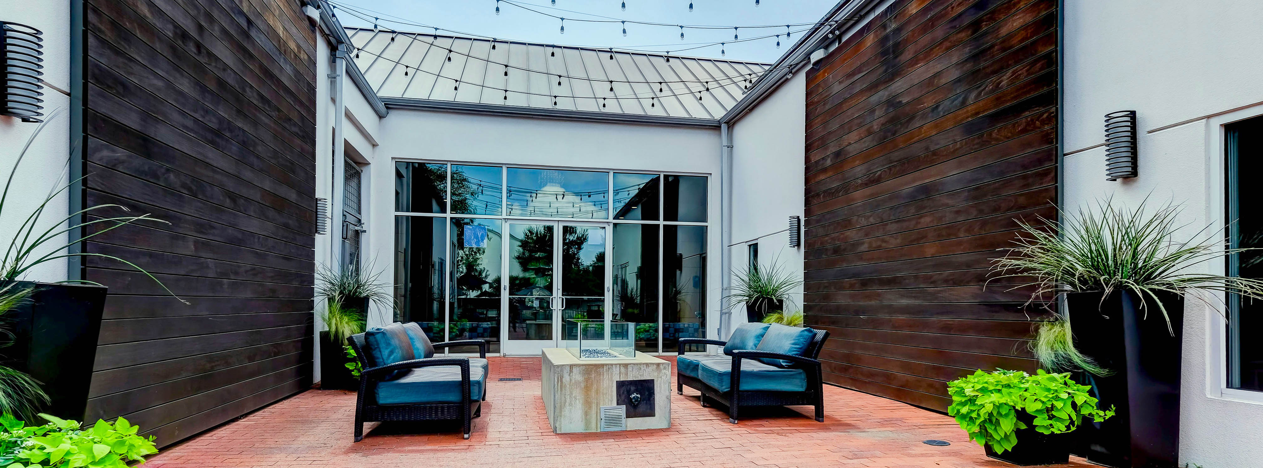 Exterior sitting area near pool and fitness center